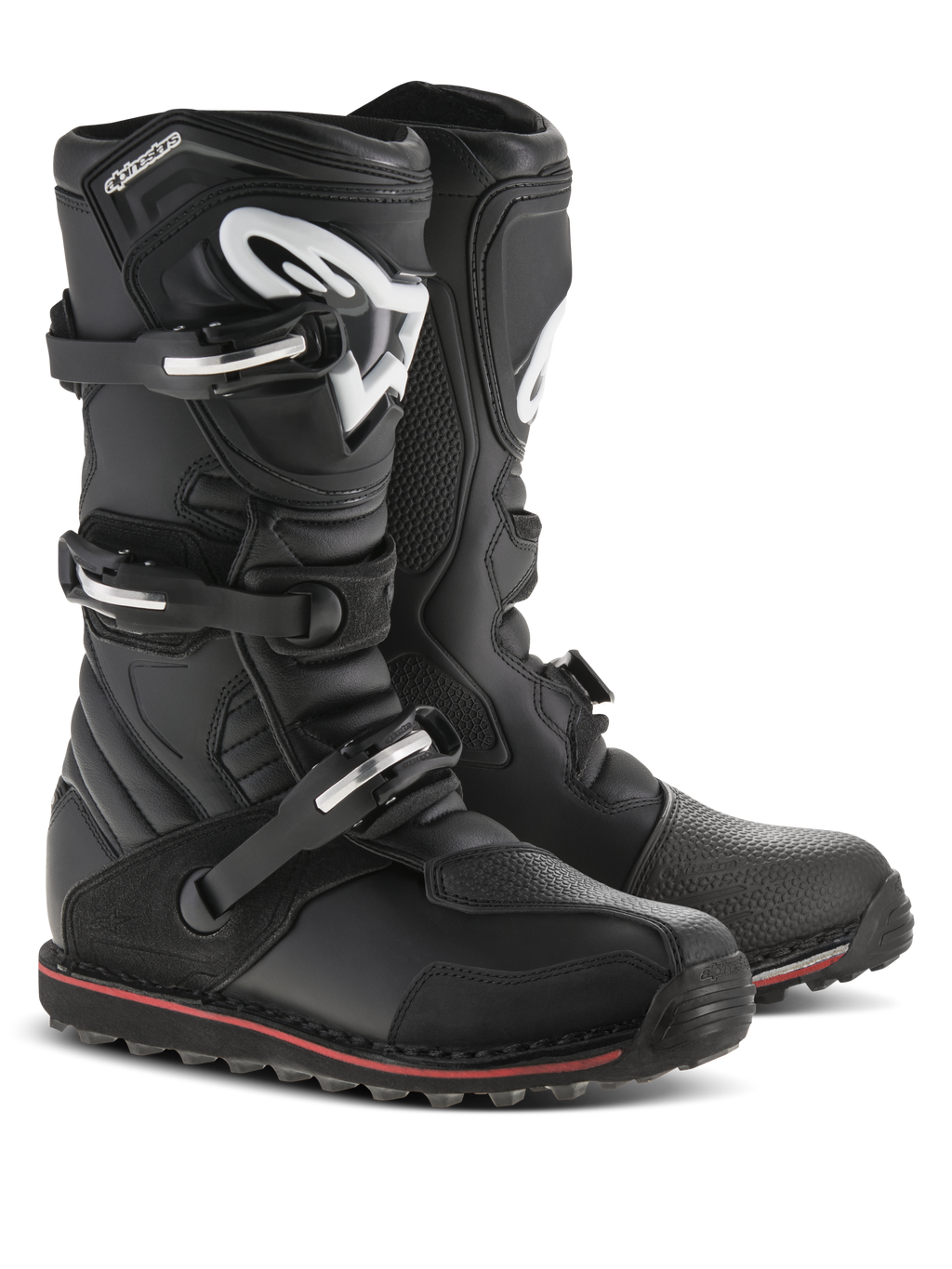 Bottes Alpinestars Tech-T, bottes de moto de trial, noir avec accents rouges et blancs, dotées d'un système de fermeture à trois boucles, plaque tibiale ergonomique avec logo Astars blanc, fine bande rouge le long de la semelle, construction en cuir durable pour le trial et le tout-terrain