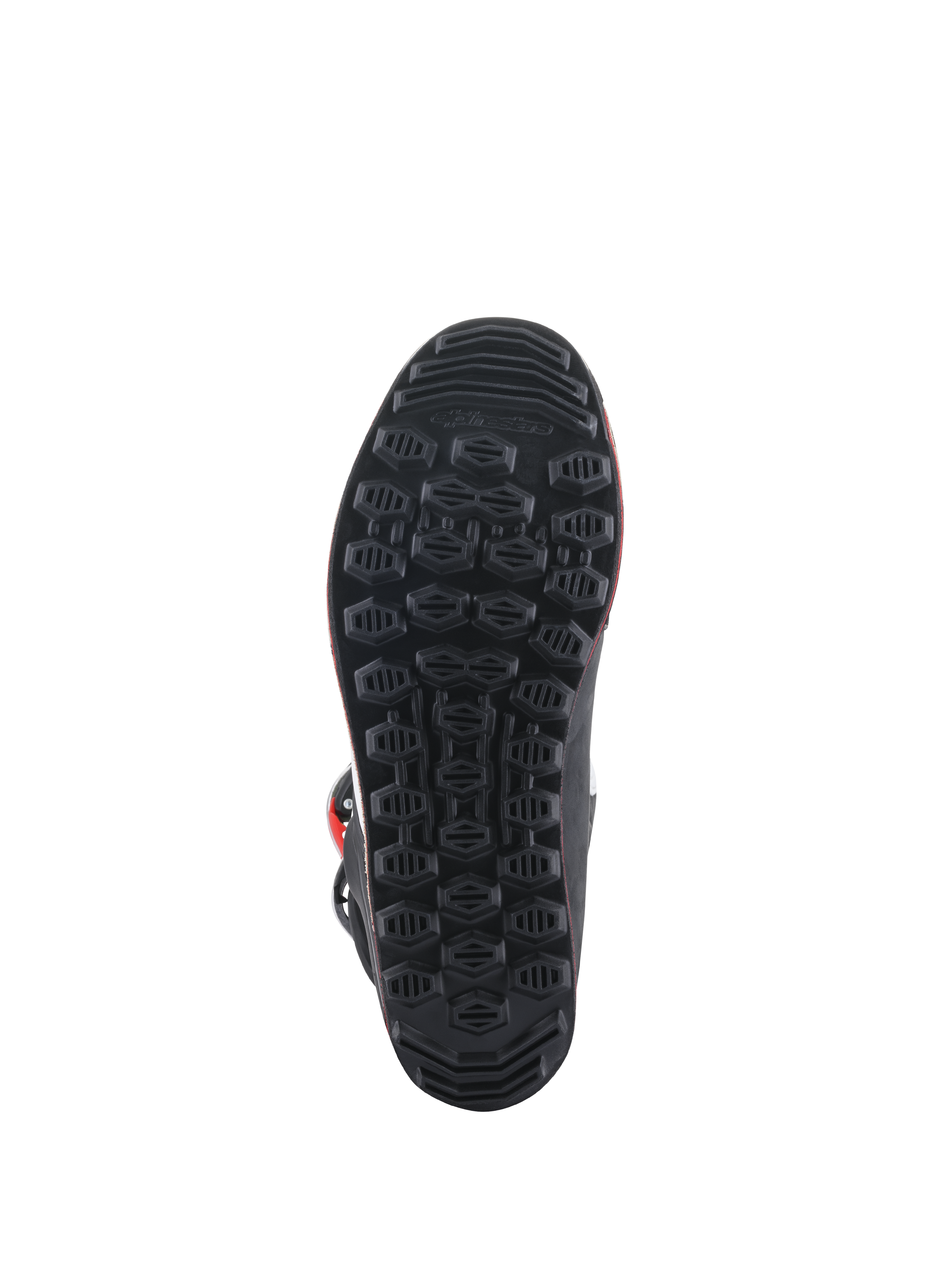 Bottes Alpinestars Tech-T, vue de la semelle, semelle extérieure en caoutchouc noir avec motif d'adhérence hexagonal texturé, conçue pour la sensibilité du pilotage trial et le contrôle des repose-pieds.