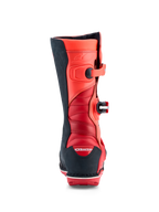 Alpinestars Tech-T, bottes de trial rouge fluo et noires, avec zones de flexion en accordéon et TPU certifié CE.