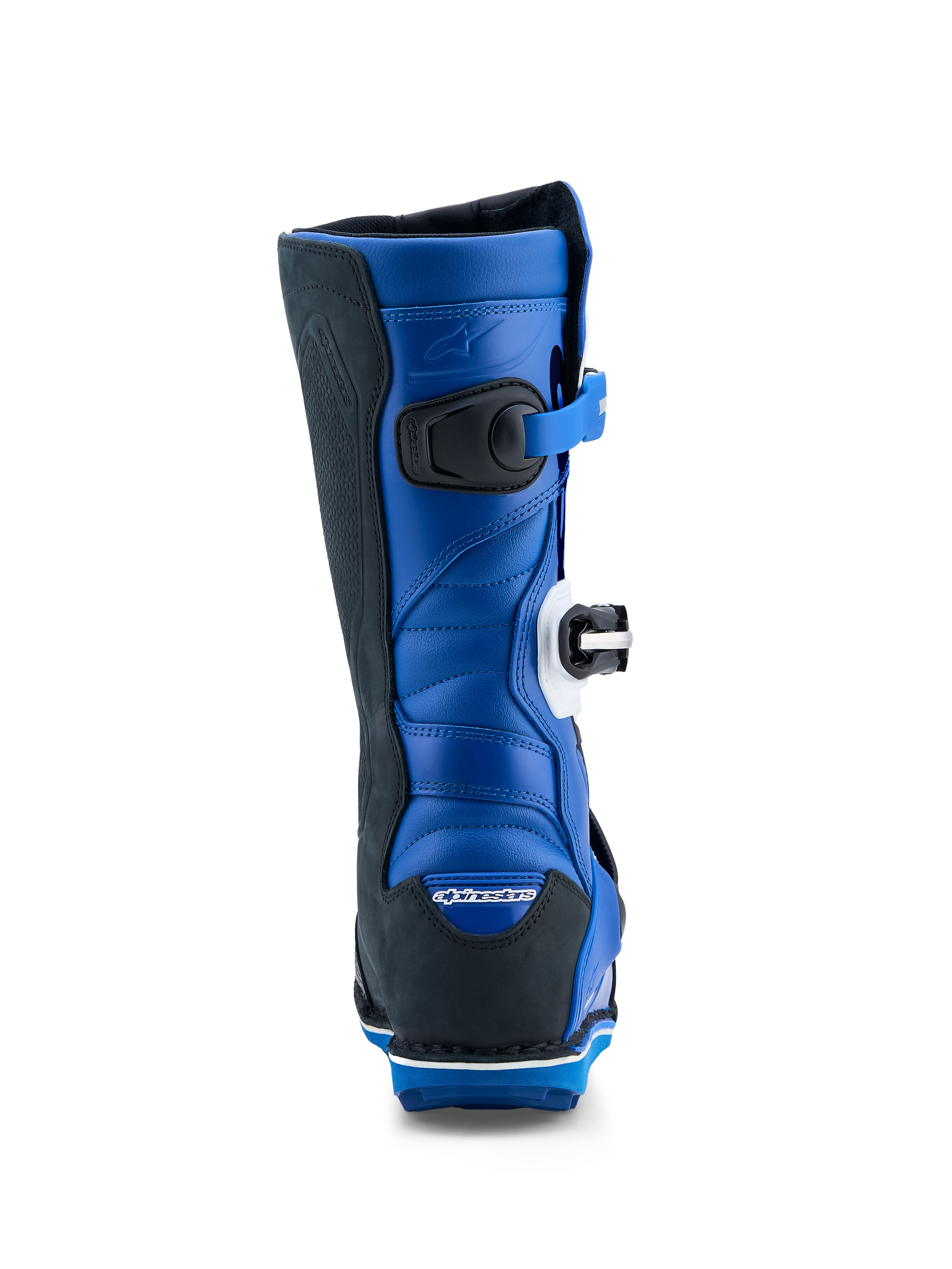 Alpinestars Tech-T, bottes de moto de trial pour homme, bleues et noires, construction en cuir avec zones d'extension en accordéon à l'arrière, certifiées CE, vue de dos montrant le talon et le mollet