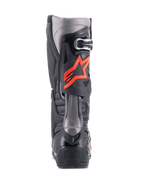 Alpinestars Tech 10 Boots, Motocross Boots, Black and Red Fluo, rear view featuring technical TPU shell, dark grey panels, and a prominent fluorescent red star logo on the calf.