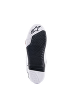 Bottes Alpinestars Tech 10, bottes de motocross, vue de dessous montrant l'insert central remplaçable noir et la semelle blanche, motif d'adhérence texturé, logo Alpinestars sur l'avant, chaussures tout-terrain durables