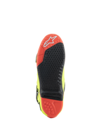Bottes Alpinestars Tech 10, bottes de motocross, jaune fluo, noir et rouge fluo, vue de la semelle en matériau bi-composant rouge et noir, insert central remplaçable et crampons de traction pour une performance tout-terrain