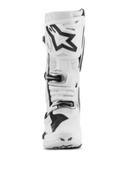 Bottes Alpinestars Tech 10 Supervented, bottes de motocross, blanches avec accents noirs, vue de face montrant le grand logo Astar noir sur la plaque tibiale, système de fermeture à boucles et sections perforées pour la ventilation.
