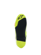 Alpinestars Tech 10 Supervented Boots, detailed sole view, Yellow Fluo and Black, featuring a honeycomb grip pattern, replaceable central insert, and textured surface for foot-peg traction