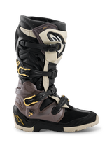Alpinestars 2026 Tech 7 Enduro Drystar® Boots, Motocross and Enduro Boots, Black Dark Gray and Gold, featuring a multi-buckle closure system with gold accents, rugged dual-compound sole, and durable TPU protective panels, professional off-road riding footwear
