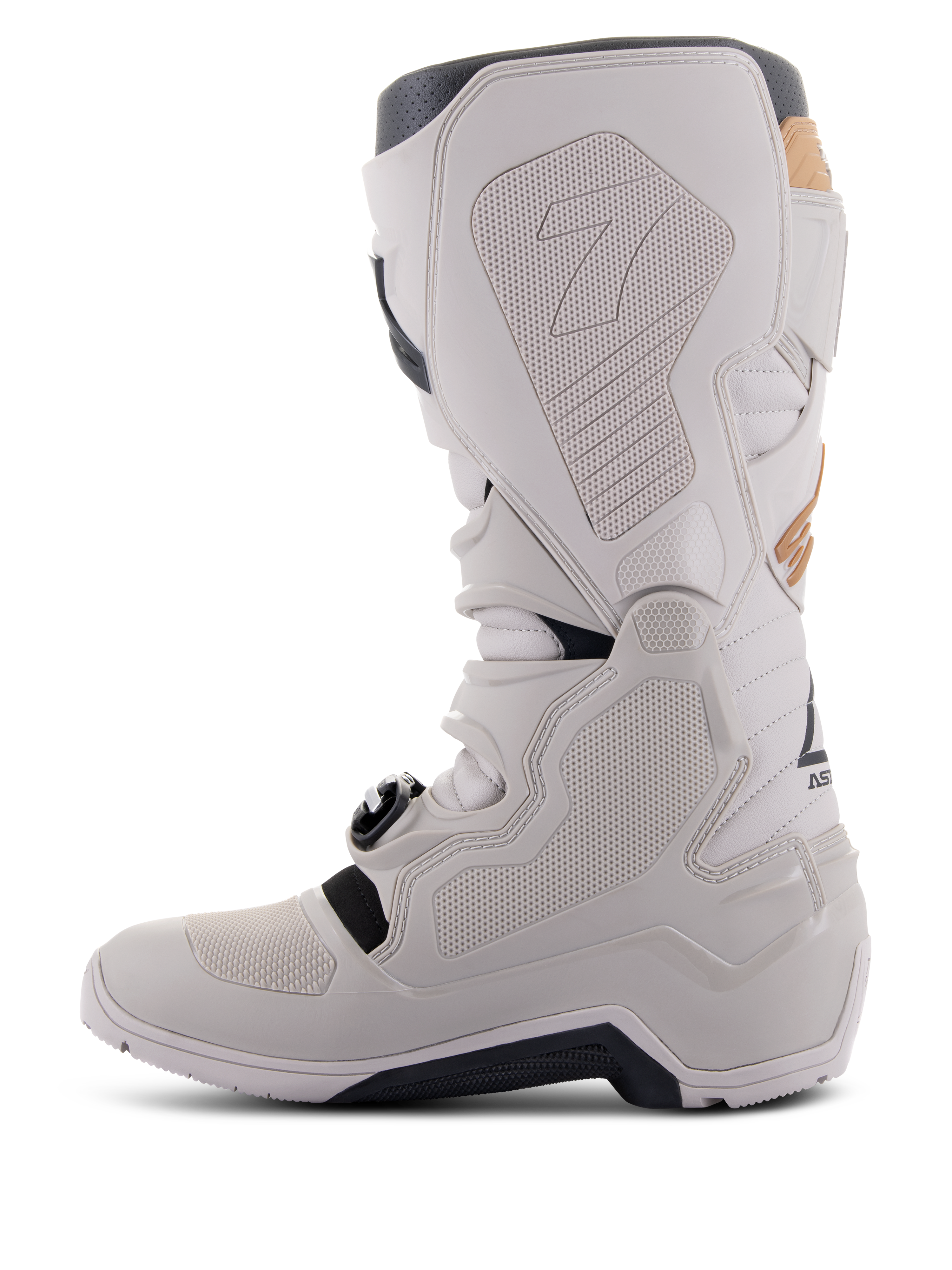 Bottes Alpinestars Tech 7 Enduro Drystar® en Gris Sable, vue du côté médial montrant des panneaux d'adhérence à texture nid d'abeille, construction en TPU gris clair et microfibre, semelle extérieure noire et membrane imperméable pour des performances tout-terrain.