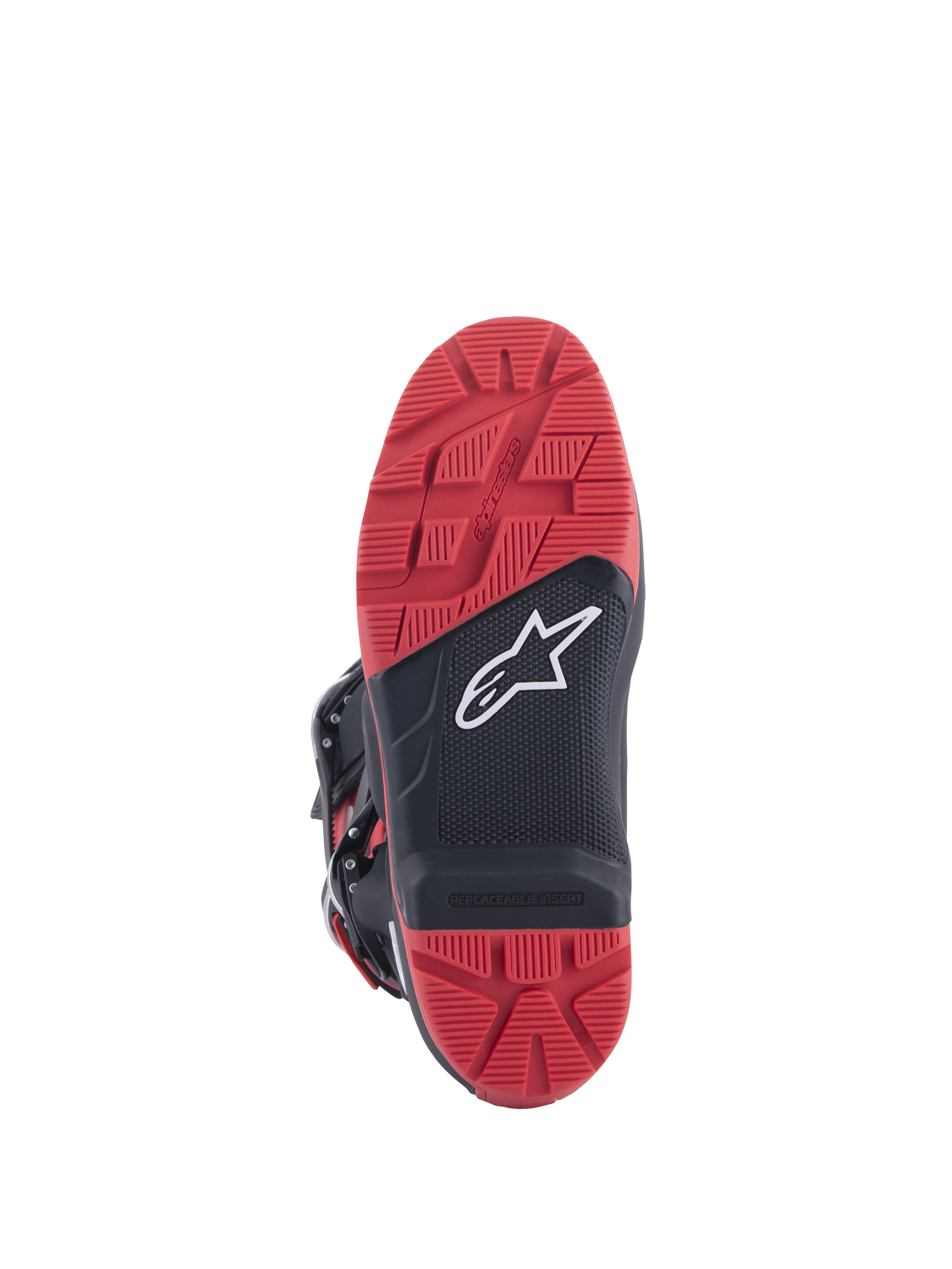 Bottes Honda Tech 7 Enduro Drystar®, noir et rouge vif, vue de la semelle montrant le motif de crampons à haute adhérence avec insert remplaçable, construction en caoutchouc à double densité et logo Alpinestars blanc sur panneau texturé noir.
