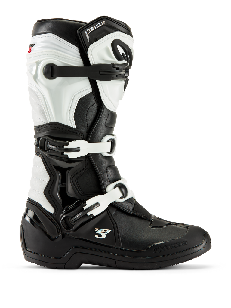 Alpinestars Tech 3 Boots, bottes de motocross, noir et blanc, vue de profil présentant un système de fermeture à trois boucles, des panneaux de protection en TPU et une construction synthétique durable pour la course tout-terrain