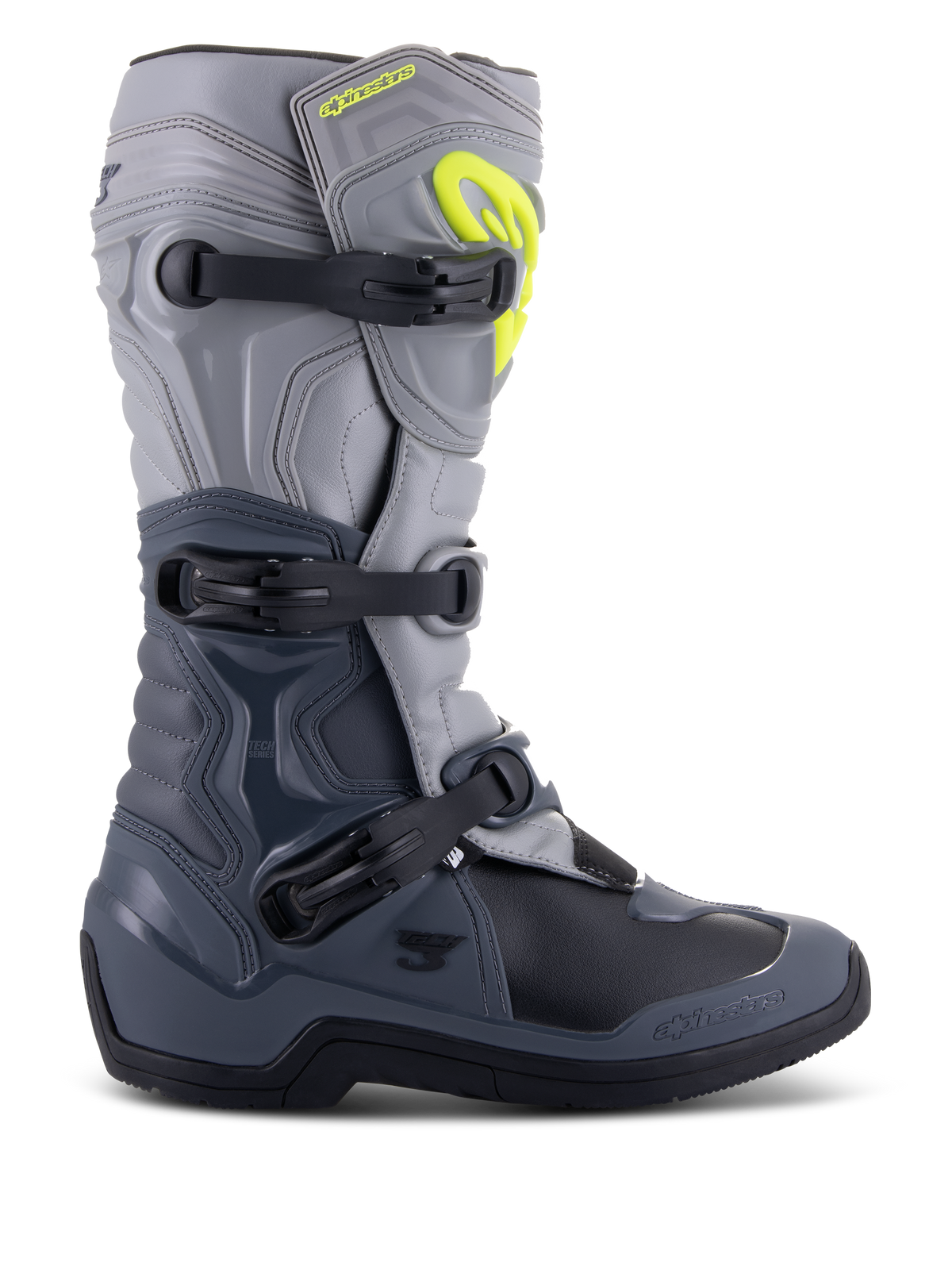 Bottes Alpinestars Tech 3, bottes de motocross, gris foncé, gris clair et noir, vue latérale présentant trois boucles en polymère noir, des panneaux de protection en TPU et un logo Alpinestars jaune vif sur la partie supérieure du tibia