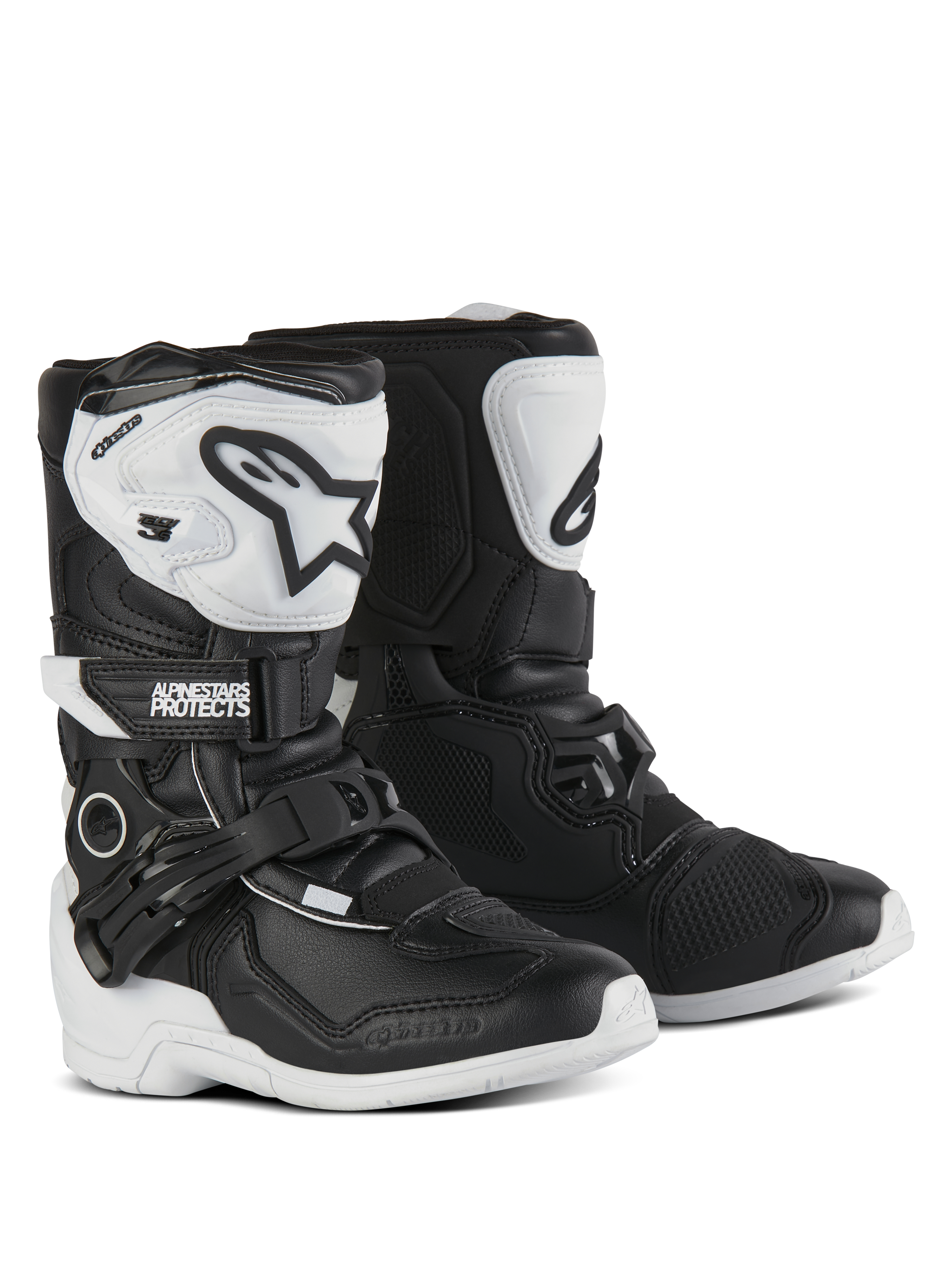 Alpinestars Kids Tech 3S Boots, Motocross Boots, Black and White, featuring white TPU shin plates with black Alpinestars logos, adjustable buckle and hook-and-loop closures, durable rubber outsoles for youth off-road protection.