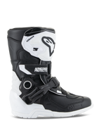 Alpinestars Kids Tech 3S Boots, Youth Motocross Boots, White and Black, lateral view showing high-top design, buckle and strap closure system, protective TPU shin plate and white sole, off-road motorcycle footwear for kids