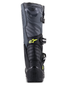 Bottes Alpinestars Tech 5, bottes de motocross, noir, gris et jaune fluo, vue arrière montrant les zones de flexion en accordéon et la protection du talon, avec logo Astars jaune et marquage Tech Series embossé, construction multi-matériaux durable pour la performance tout-terrain