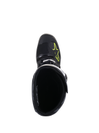 Bottes Alpinestars Tech 5, vue de dessus, noir avec logo jaune fluo sur la pointe, montrant la doublure intérieure et la fermeture à boucle, chaussures de motocross et tout-terrain haute performance