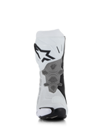 Bottes Alpinestars Supertech R Vented, blanc, gris moyen et noir, vue arrière montrant la construction en microfibre perforée, plaque de talon grise redessinée avec texture en nid d'abeille, logo noir imposant sur le haut du mollet, chaussures de moto professionnelles de course et de sport
