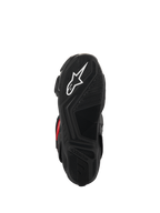 Bottes Alpinestars SMX-6 V3 Drystar®, vue de la semelle, caoutchouc texturé noir pour l'adhérence, avec logo étoile blanc et marquage Alpinestars embossé, chaussures de moto haute performance