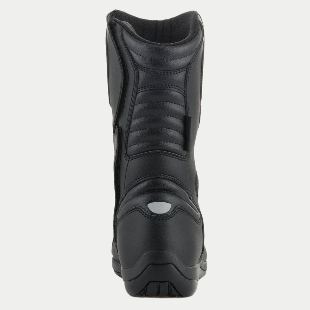 Bottes Alpinestars Origin Drystar®, bottes de moto touring, noires, vue arrière avec zones de flexion en accordéon sur le tendon d'Achille et le mollet, détail réfléchissant au talon et construction en microfibre durable