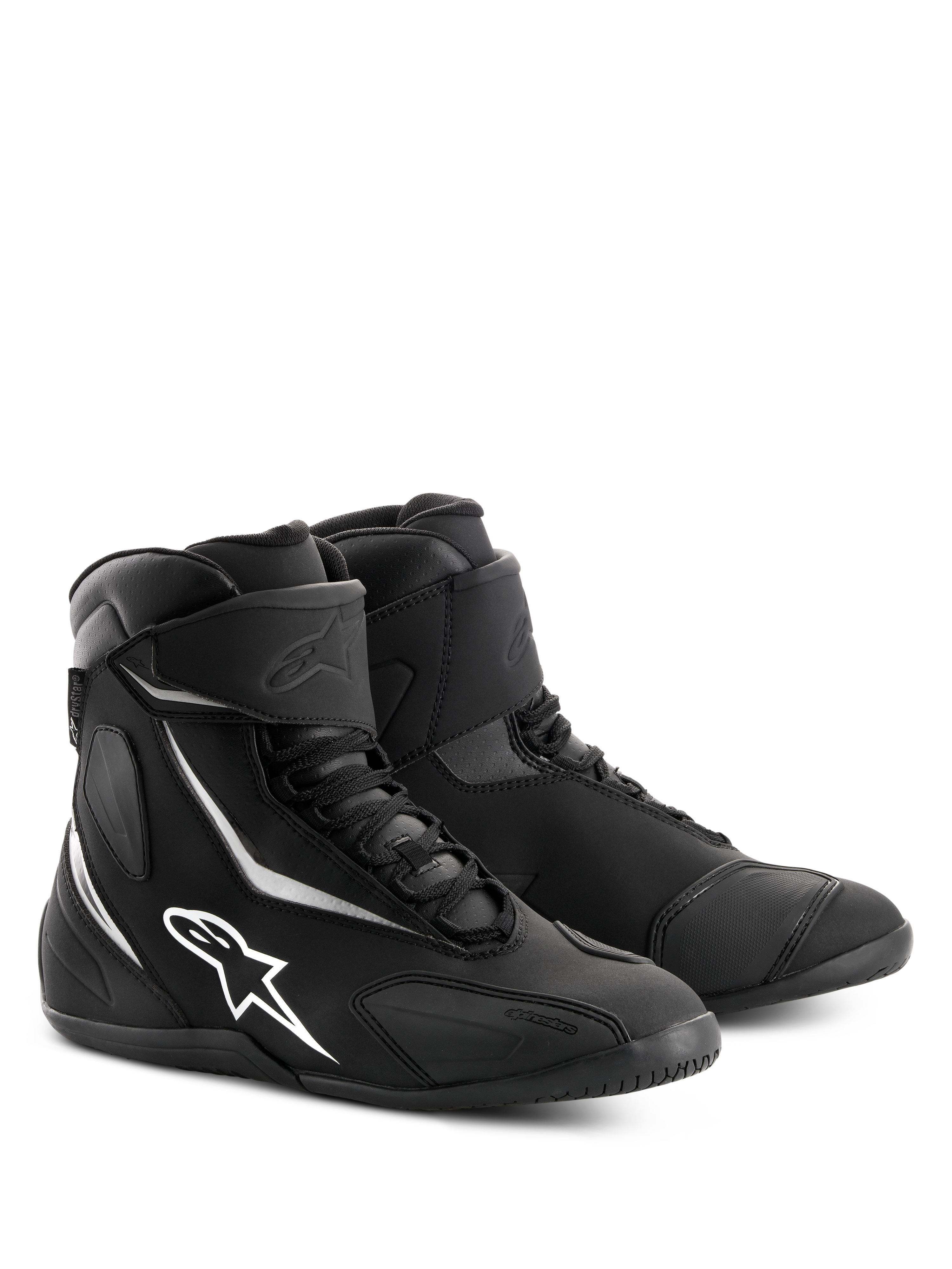 Chaussures imperméables Alpinestars Fastback 2 Drystar®, chaussures de moto noires et blanches, design montant avec logo Alpinestars et accents blancs, fermeture à lacets avec sangle de cheville auto-agrippante, construction robuste pour le touring routier.