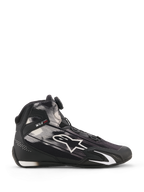 Chaussures Alpinestars Celer Superair, chaussures de moto, noir et blanc, vue de profil avec motifs graphiques blancs et grand logo Astar, système de fermeture Rotor sur la languette, protection de la cheville en TPU avec slogan « ONE GOAL ONE VISION », tige en textile respirant pour temps chaud