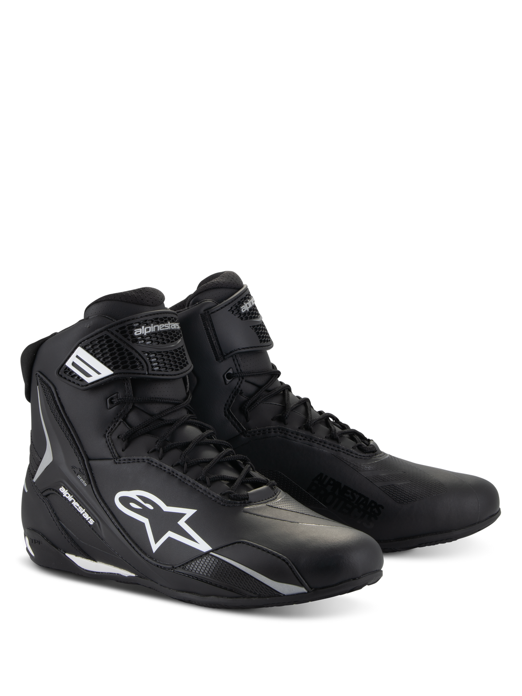 Chaussures Alpinestars Stella Faster-4, chaussures de moto pour femme, noir avec accents blancs, design sportif montant avec fermeture à lacets et sangle de cheville à scratch, construction en microfibre durable avec logos latéraux de protection