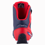 Chaussure de moto Alpinestars Austin, Bleu Marine et Rouge Vif, vue arrière montrant le contrefort de talon en TPU renforcé, la doublure en mesh rouge et la semelle extérieure en caoutchouc texturé, chaussures de moto sportives