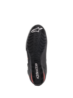 Chaussures Alpinestars Faster-3 Drystar®, chaussures de moto, noir et rouge fluo, vue de dessous de la semelle, semelle extérieure en caoutchouc texturé avec motif ondulé, arborant l'étoile et le logo Alpinestars blancs, chaussures de performance imperméables