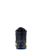Chaussures de moto Alpinestars CR-X Drystar®, noir, bleu foncé et jaune fluo, vue arrière mettant en évidence le logo au talon et la semelle extérieure bleue, performance imperméable avec des accents jaune fluo