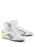 Alpinestars Supertech K Shoes - FIA, Karting Shoes, White Black and Gold, featuring a knitted upper, metallic gold heel counter, black Alpinestars logo with gold border, professional racing footwear for karting