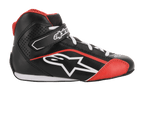 Chaussures Alpinestars Youth Tech-1 K, chaussures de karting, noir, blanc et rouge, vue de profil présentant une construction en microfibre, un logo Alpinestars blanc, une sangle de cheville auto-agrippante et des panneaux latéraux perforés pour la ventilation.