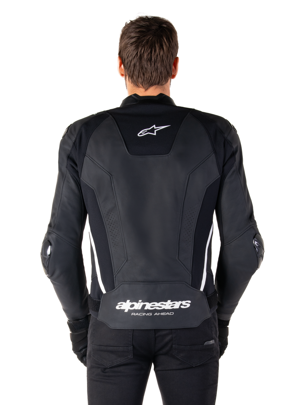 Vue arrière de la veste en cuir Alpinestars Missile V3 en noir et blanc, avec le logo étoile Alpinestars sur le haut du dos, le marquage sur la zone lombaire, des bandes verticales blanches et des sliders de coude externes, veste de sport racing en cuir premium.