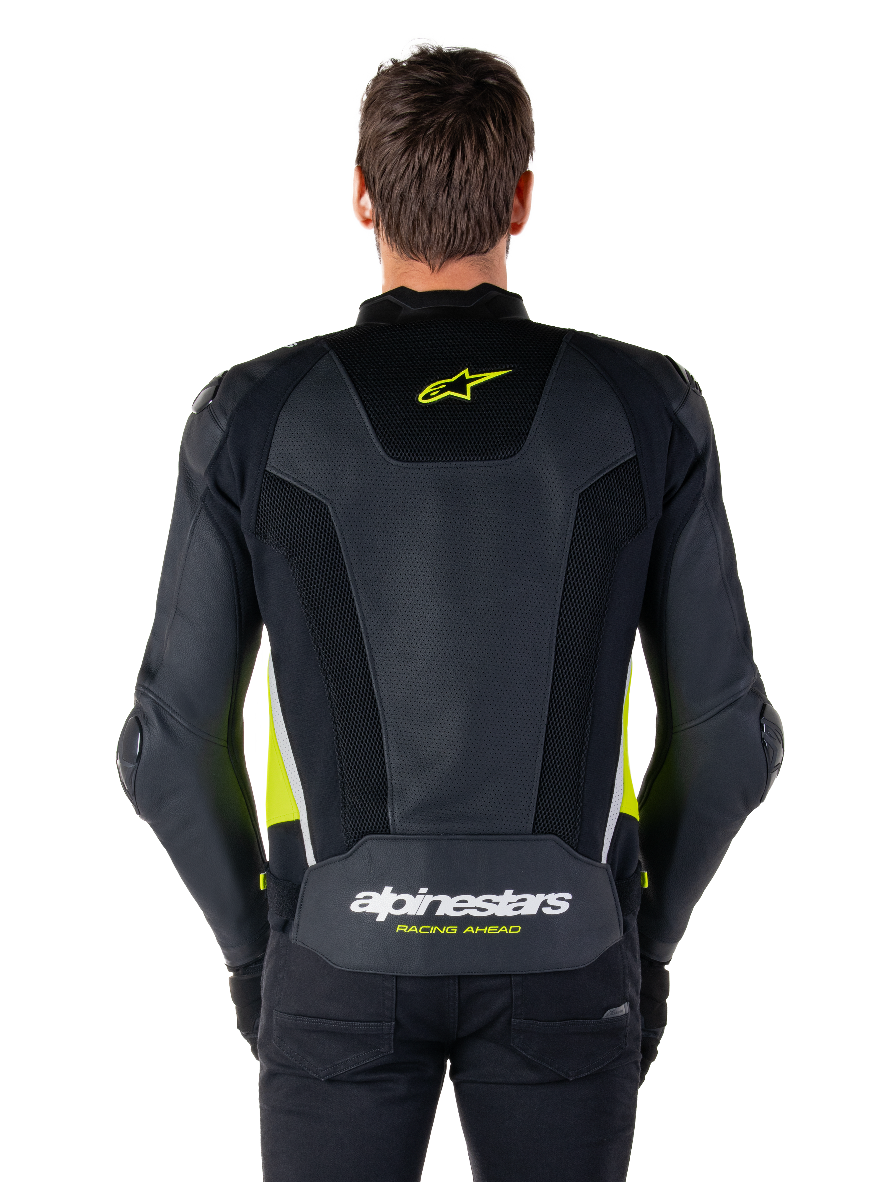 Veste en cuir Alpinestars Missile V3 Airflow, vue arrière, noir avec accents jaune fluo et blanc, larges panneaux en cuir perforé pour la ventilation, logos Alpinestars sur le haut et le bas du dos, veste de moto sport d'inspiration racing