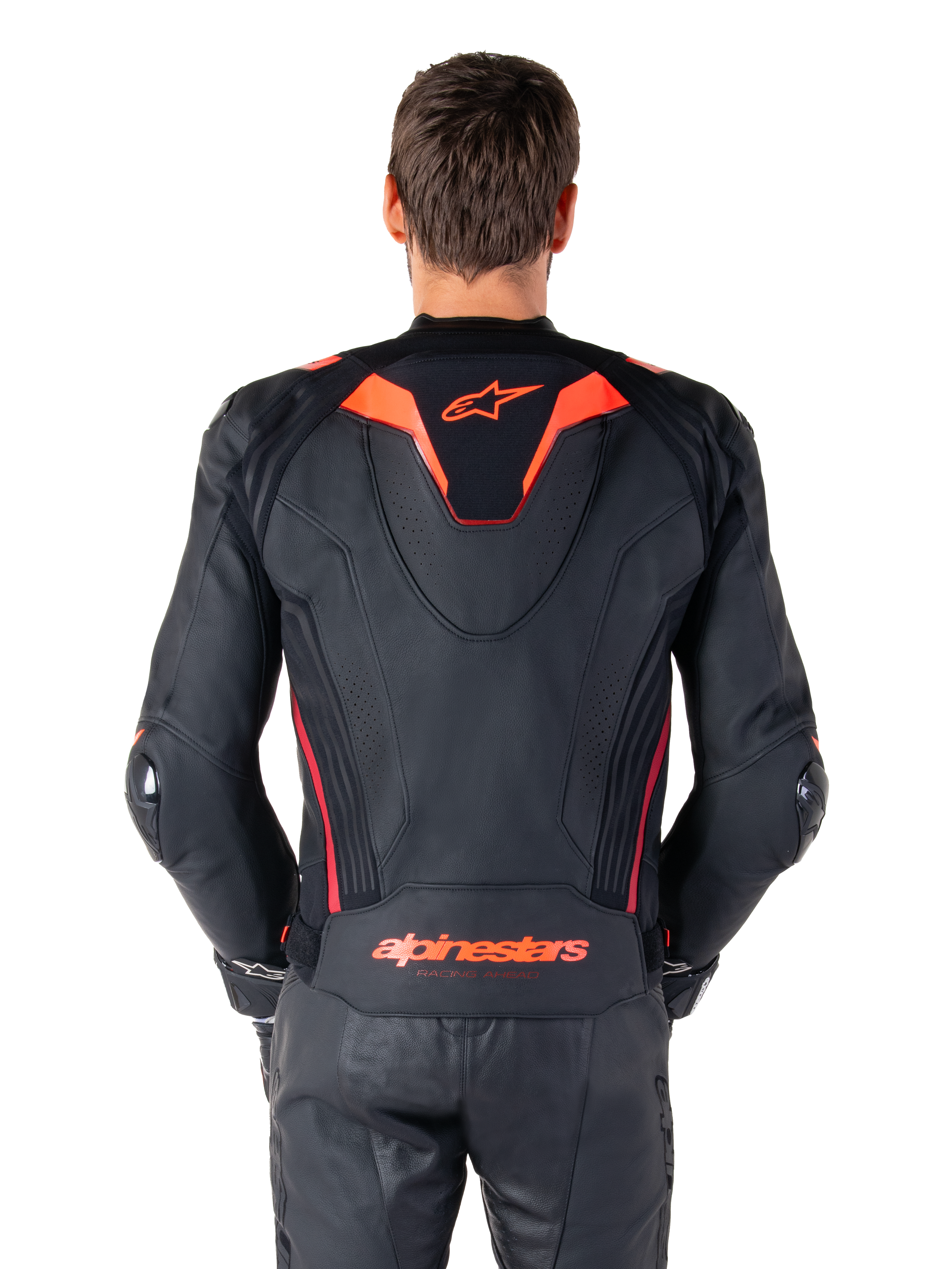 Alpinestars Missile V3 Ignition Leather Jacket, Rear View, Black with Red Fluo and Dark Red accents, featuring a sport aero-hump, Alpinestars branding on the back, worn with matching black leather riding pants, performance motorcycle racing gear
