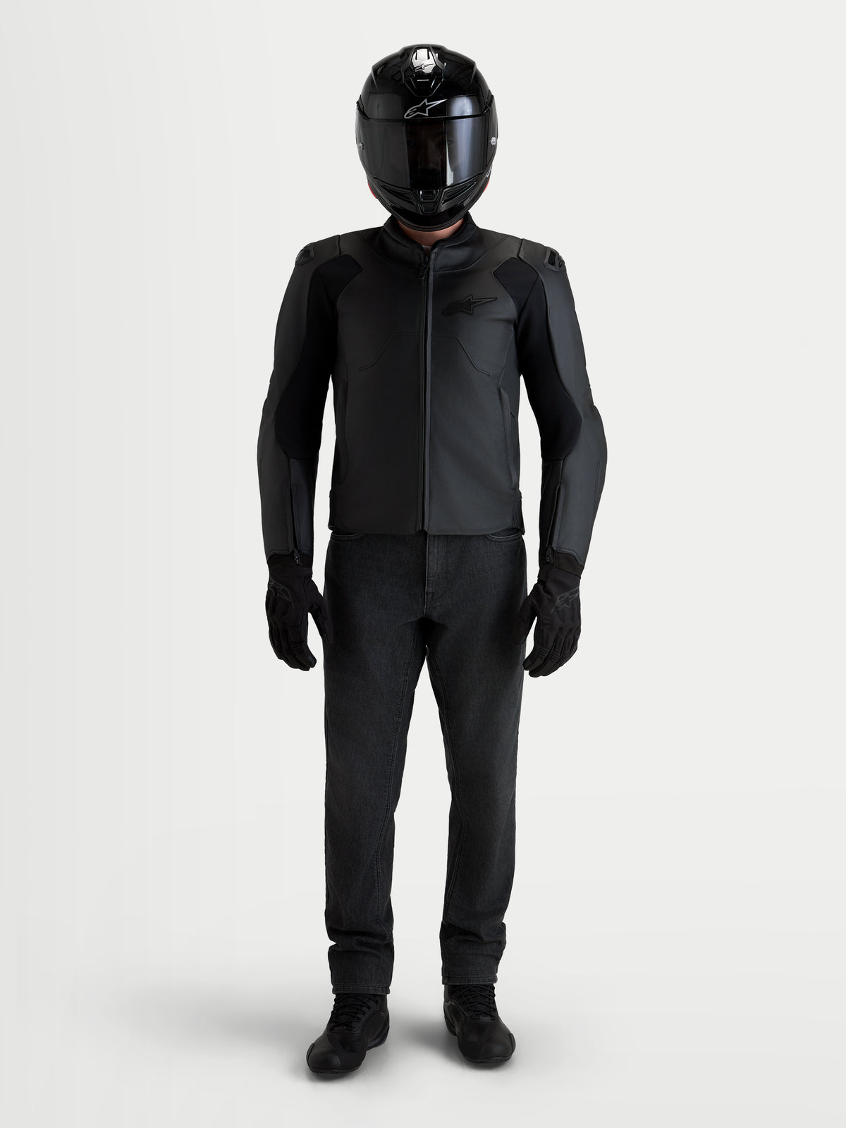 Alpinestars Caliber V2 Leather Jacket, Men's Black motorcycle leather jacket, featuring low-profile DFS shoulders and sport fit, worn by a rider