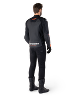 Alpinestars Faster V3 Leather Jacket, Sport Motorcycle Jacket, Black and Red Fluo, rear view worn with black pants and black boots, featuring 'alpinestars RACING AHEAD' text on the lower back and a small red star logo, sleek sport-fit leather construction