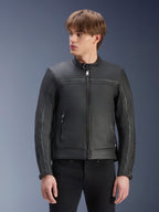 Alpinestars Dyno Leather Jacket, Black, premium bovine leather motorcycle jacket, worn by model with black pants, heritage-inspired design with central zipper and low-profile stand-up collar, urban contemporary motorcycle apparel.