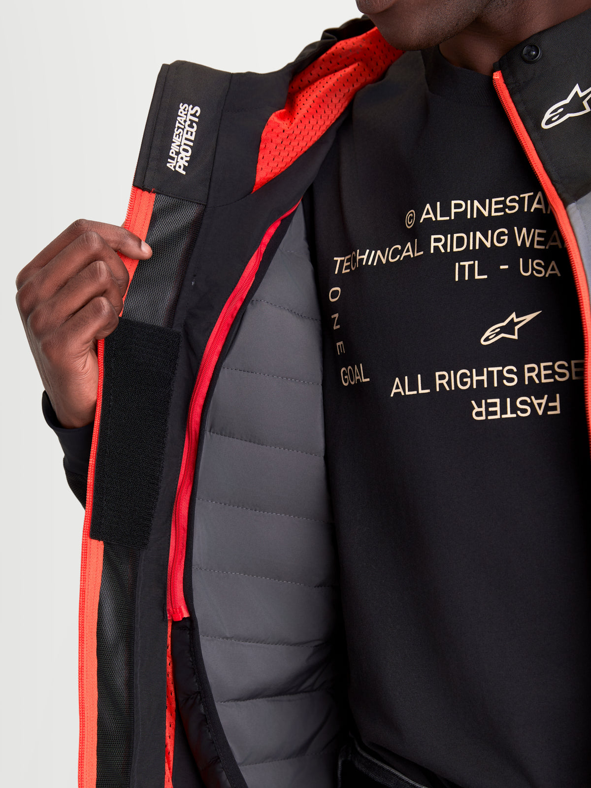 Alpinestars Morfex Parka Waterproof Jacket, men's urban contemporary motorcycle jacket in lunar gray and black, close-up view showing the internal thermal vest, mesh lining, and modular construction features worn by a model