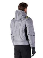 Alpinestars Mohobbs Waterproof Jacket in Lunar Gray and Lime Punch, rear view on a model, quilted padded bomber design with vertical embossed astars branding on the back, lime green shoulder accents, hooded, worn with black motorcycle pants and gloves.