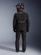 Alpinestars Cusco Drystar Jacket, Motorcycle Adventure Jacket, Black, back view worn with matching pants and a black and white helmet, featuring reflective Alpinestars branding and large ventilation panels, durable textile construction for road adventure touring