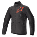 Veste Alpinestars Hyde XT Drystar XF, veste de moto technique noire et rouge vif, grand logo étoile rouge sur la poitrine, zips de ventilation verticaux sur le torse, col haut, tissu texturé extensible dans les quatre sens, conçue pour l'aventure et le pilotage tout-terrain