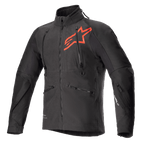Veste Alpinestars Hyde XT Drystar XF, veste de moto technique noire et rouge vif, grand logo étoile rouge sur la poitrine, zips de ventilation verticaux sur le torse, col haut, tissu texturé extensible dans les quatre sens, conçue pour l'aventure et le pilotage tout-terrain
