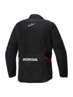 Veste imperméable Alpinestars Honda ST-1, vue arrière, textile noir, avec logo étoile Alpinestars blanc sur le haut du dos et marquage Honda sur la poche cargo arrière, accents rouges sur les côtés, veste de moto de touring durable