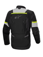 Veste Alpinestars Bogota' Pro Drystar®, veste de moto touring aventure pour homme, noire, grise et jaune fluo, textile imperméable certifié CE, vue de dos montrant les panneaux de ventilation.