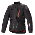 Veste Alpinestars AMT-10R Drystar XF, noire et orange, veste de moto touring aventure, empiècements gris aux épaules, multiples fermetures éclair avec tirettes orange, sangles ajustables, doublure intérieure rouge, équipement de protection technique