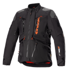Veste Alpinestars AMT-10R Drystar XF, noire et orange, veste de moto touring aventure, empiècements gris aux épaules, multiples fermetures éclair avec tirettes orange, sangles ajustables, doublure intérieure rouge, équipement de protection technique