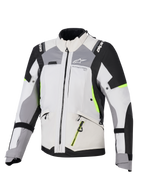 Veste Alpinestars Stella Andes V4 Drystar® pour femme, veste de touring d'aventure, gris glacier et gris foncé avec des accents noir et jaune fluo, construction textile durable avec fermetures éclair imperméables et logo Alpinestars, vue de face