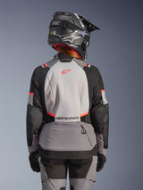 Alpinestars Stella Andes V4 Drystar® Women's Adventure Jacket in Gray and Black with Coral Fluo, back view on model.