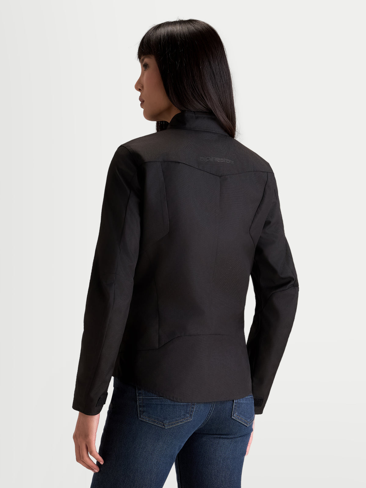 Alpinestars Stella C-1 Waterproof Veste, veste de moto urbaine en textile pour femme noire, vue de dos montrant la construction du dos et le col souple portée par un modèle