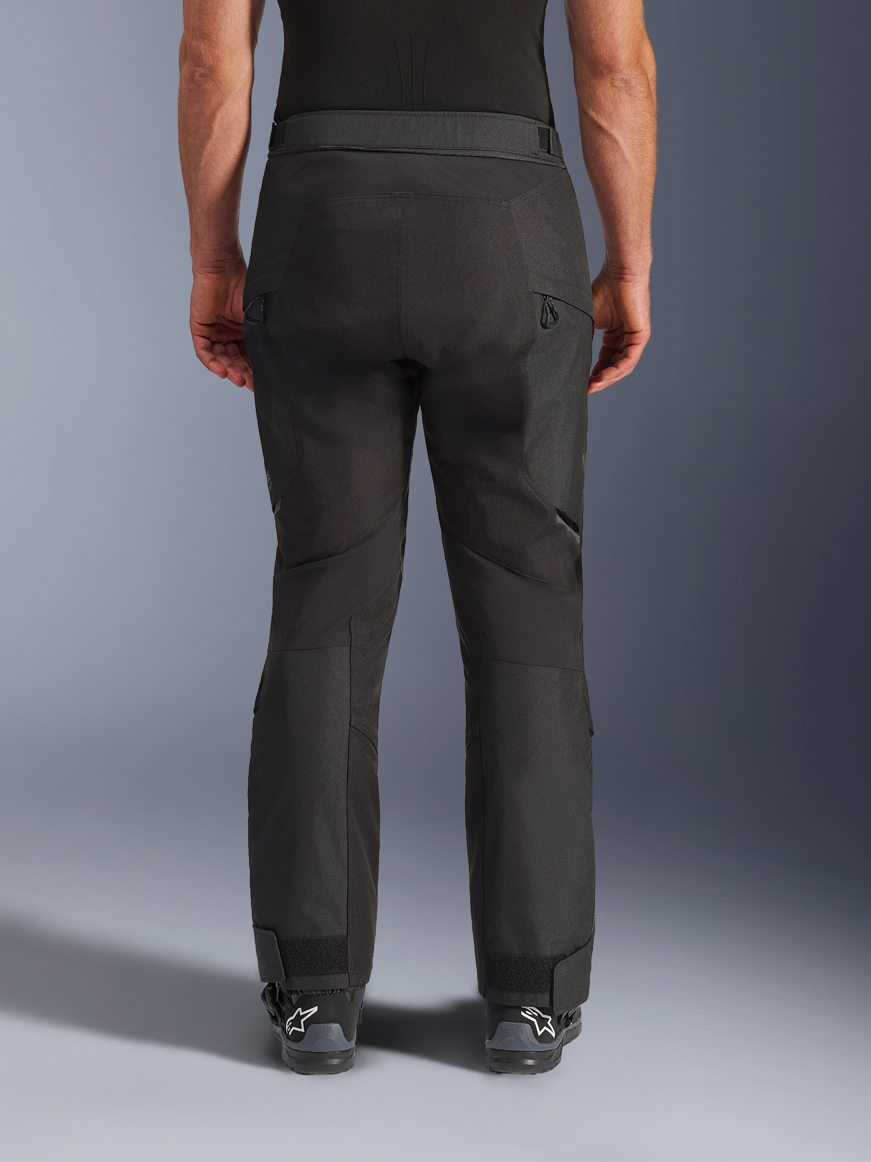 Alpinestars Cusco Drystar® Pants, Motorcycle Adventure Pants, Black, rear view showing articulated panels, zippered thigh vents, and adjustable ankle cuffs, designed for touring and off-road riding