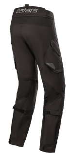 Alpinestars Halo Drystar® Pants, pantalon de moto adventure touring, noir, vue latérale arrière avec le logo astars sur la taille, poches cargo fonctionnelles et sangles réglables sur les jambes pour un maintien optimal.