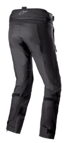 Alpinestars Bogotá Pro Drystar® 3 Seasons Pants, Black adventure touring motorcycle pants shown from the rear, featuring a waistband logo, adjustable leg straps, and technical textile construction with reinforced panels.